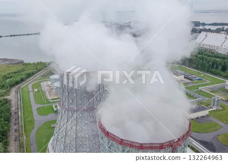 Soaring steam towers of nuclear power plant. 132264963