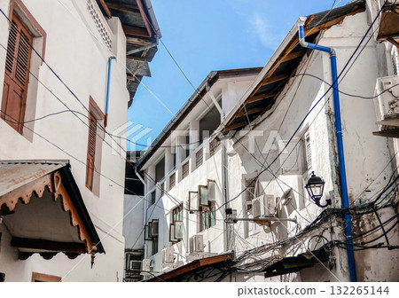 This scene captures the authentic, rustic charm and unique architectural details of a historic city like Stone Town in Zanzibar This scene captures the authentic, rustic charm and unique architectural details of a historic city like Stone Town in Zanzibar 132265144