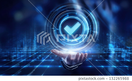 Holographic luminescent checkmark emerging from a sleek digital interface in a futuristic setting 132265988