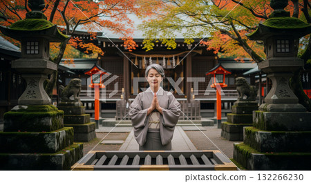 Japanese woman in kimono visiting a shrine Japanese woman in kimono visiting a shrine 132266230