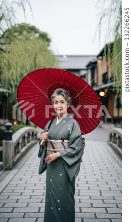 An elderly Japanese woman in a kimono, Kyoto's charming streets 132266245