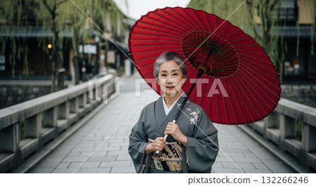 An elderly Japanese woman in a kimono, Kyoto's charming streets 132266246