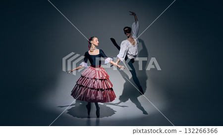 Dance of contrast. Two ballet performers creating visual balance in stage light. 132266366