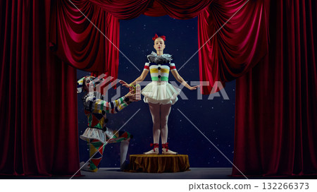 Gift of performance. Mime presenting small box to ballerina on stage. 132266373