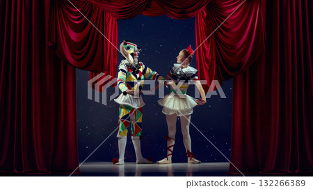 Life on stage. Mime and ballerina standing together on theater stage in colorful costumes. Life on stage. Mime and ballerina standing together on theater stage in colorful costumes. 132266389