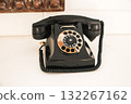 An old black corded telephone for the interest of hotel guests 132267162
