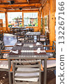 Outdoor cafe with wooden furniture, wooden floor and walls 132267166