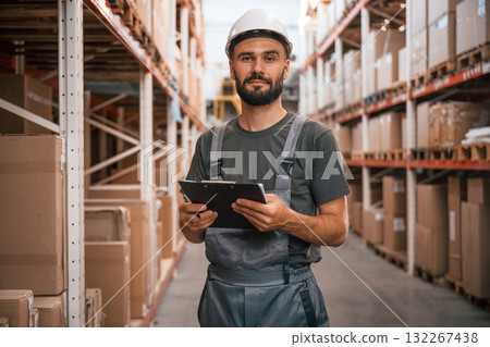 Conception of shipping distribution business. Foreman is in the storehouse Conception of shipping distribution business. Foreman is in the storehouse 132267438
