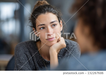 Therapist listening to patient during mental health counseling session 132267686
