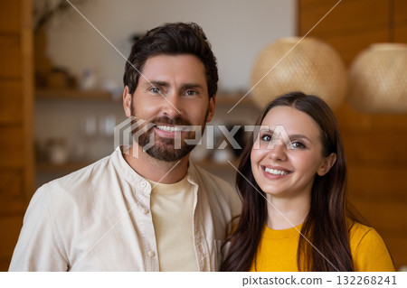 Smiling man and woman feeling excited and joyful together Smiling man and woman feeling excited and joyful together 132268241