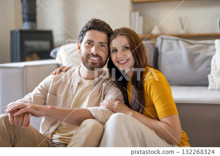 Man and woman sitting next to each other and feeling peaceful and happy Man and woman sitting next to each other and feeling peaceful and happy 132268324
