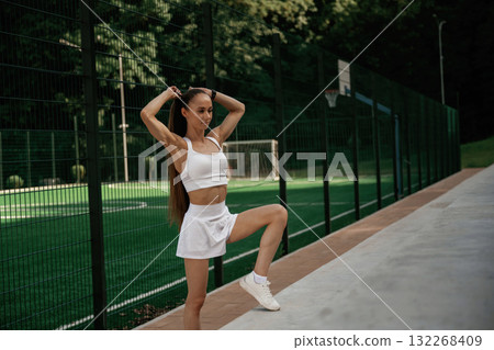 Outdoors, fitness conception. Young skinny woman is outdoors Outdoors, fitness conception. Young skinny woman is outdoors 132268409