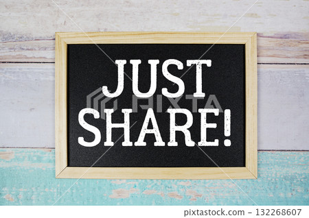 Just Share! text with blackboard on wooden background 132268607