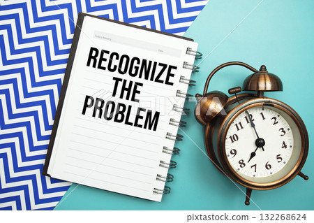 Recognize The Problem text written on notepad with alarm clock Recognize The Problem text written on notepad with alarm clock 132268624
