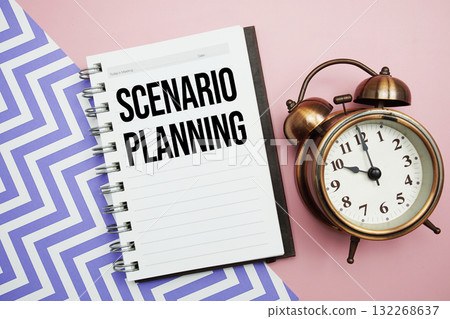 Scenario Planning text written on notepad with alarm clock 132268637