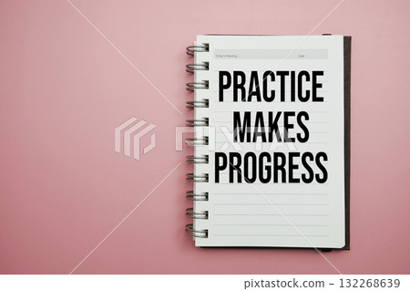 Practice Makes Progress text written on notepad with alarm clock Practice Makes Progress text written on notepad with alarm clock 132268639