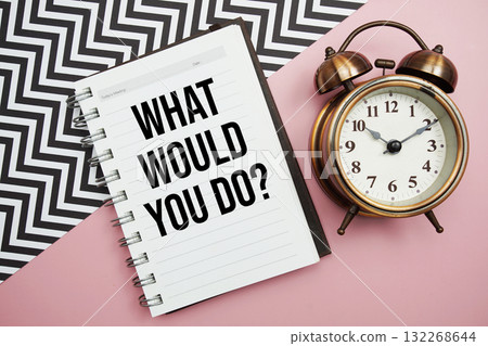 What Would You Do? text written on notepad with alarm clock 132268644
