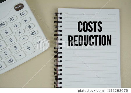 Costs Reduction text with calculator phrase of business and financial concept 132268676