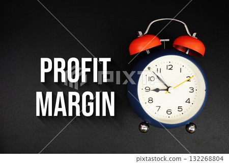 Profit Margin text with alarm clock on black background Profit Margin text with alarm clock on black background 132268804