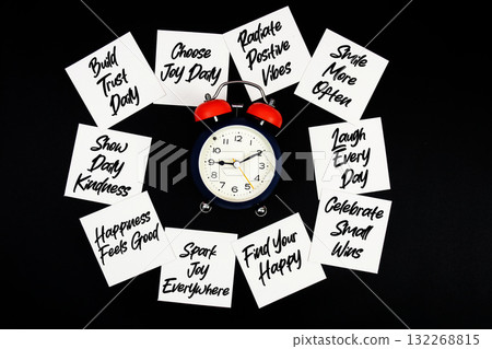 Alarm Clock Surrounded with Message about Happy Life Concept Alarm Clock Surrounded with Message about Happy Life Concept 132268815