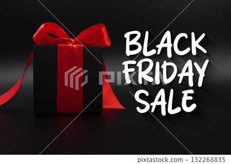 Black Friday Sale text with gift box present on black background Black Friday Sale text with gift box present on black background 132268835