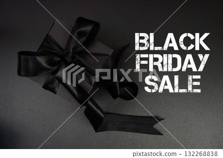 Black Friday Sale text with gift box present on black background Black Friday Sale text with gift box present on black background 132268838