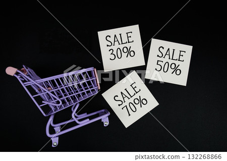 Mini Trolley Shopping Cart and sticky note with message "Sale 30%, 50%, 70%" Mini Trolley Shopping Cart and sticky note with message "Sale 30%, 50%, 70%" 132268866