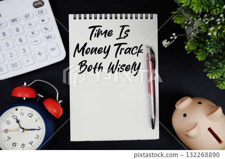 Time Is Money Track Both Wisely text with calculator with alarm clock and piggy bank on black background Time Is Money Track Both Wisely text with calculator with alarm clock and piggy bank on black background 132268890