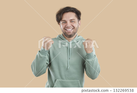 Portrait of happy young man doing winner gesture Portrait of happy young man doing winner gesture 132269538
