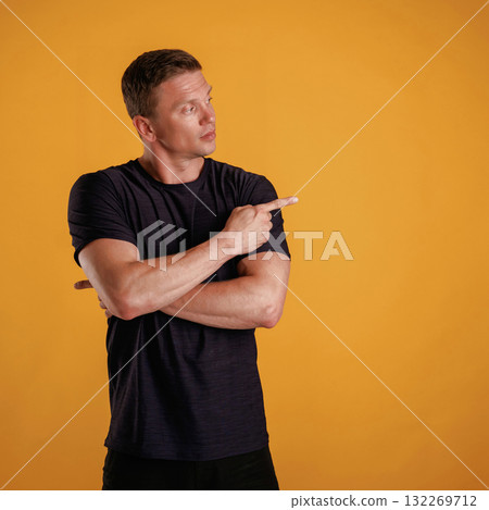 Invisible copy space, arms. Man is against background in the studio 132269712