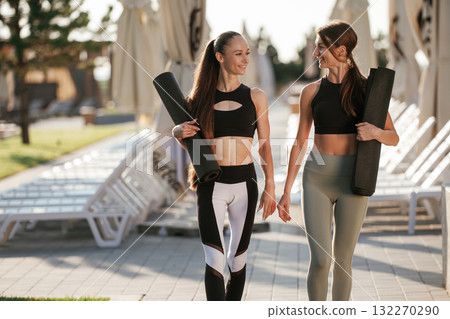 Two fitness women are together outdoors, conception of sport Two fitness women are together outdoors, conception of sport 132270290