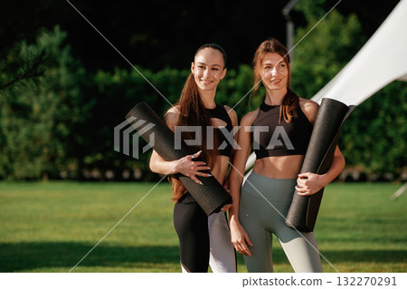 Cheerful facial expressions. Two fitness women are together outdoors, conception of sport Cheerful facial expressions. Two fitness women are together outdoors, conception of sport 132270291