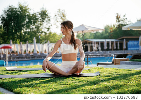 Fitness woman is outdoors, beautiful vacation place Fitness woman is outdoors, beautiful vacation place 132270688