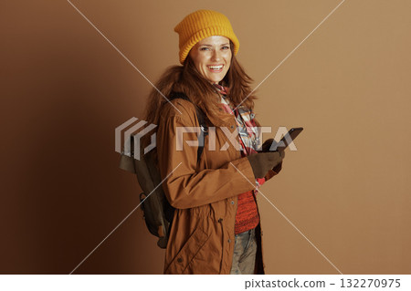 Hiker Woman with Smartphone and Backpack Hiker Woman with Smartphone and Backpack 132270975