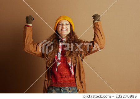 Joyful Hiker\'s Triumph in Warm Autumn Attire Joyful Hiker\'s Triumph in Warm Autumn Attire 132270989