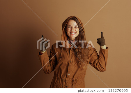 Enthusiastic Woman Pointing Upwards Enthusiastic Woman Pointing Upwards 132270995