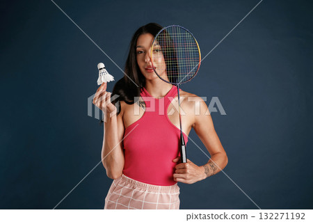 Badminton player. Beautiful young woman is against background Badminton player. Beautiful young woman is against background 132271192