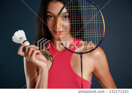 Hobby conception, badminton player. Beautiful young woman is against background Hobby conception, badminton player. Beautiful young woman is against background 132271201