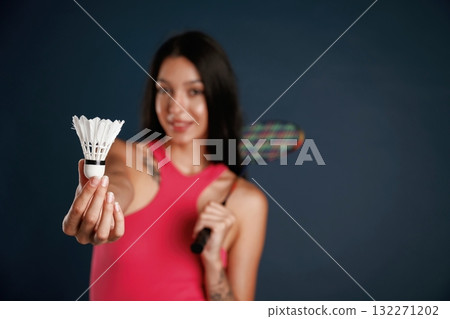 Hobby conception, badminton player. Beautiful young woman is against background 132271202