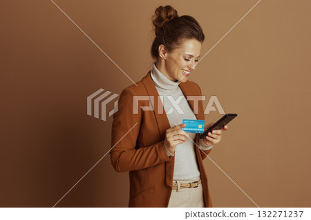 Concentrated Woman Making Mobile Payment Concentrated Woman Making Mobile Payment 132271237