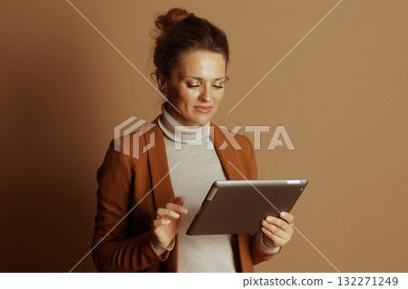 Concentrated Businesswoman Interacting with Tablet Concentrated Businesswoman Interacting with Tablet 132271249