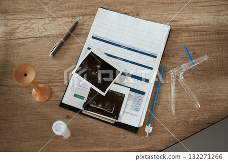 Ultrasonography pictures. Doctor's equipment, objects on the table Ultrasonography pictures. Doctor's equipment, objects on the table 132271266