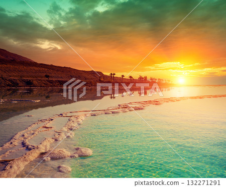 Seascape in the morning. Orange sunrise over the Dead Sea Seascape in the morning. Orange sunrise over the Dead Sea 132271291