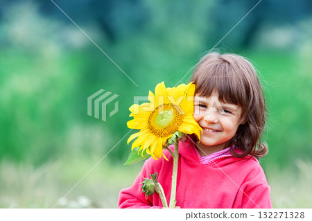 Little girl with sunflower outdoors 132271328