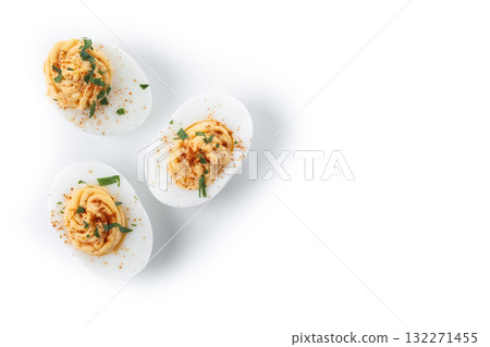 Homemade hard Boiled Deviled Eggs garnished with herbs isolated on white background 132271455