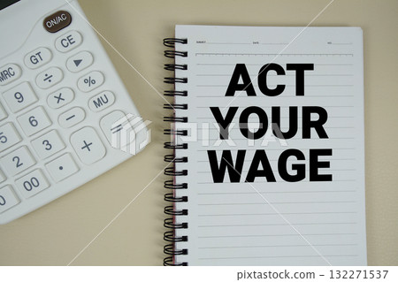 Act Your Wage text with calculator phrase of business and financial concept Act Your Wage text with calculator phrase of business and financial concept 132271537