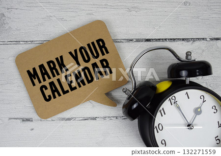 Mark Your Calendar text with alarm clock on wooden background 132271559