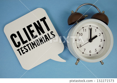 Client Testimonials text with alarm clock on blue background Client Testimonials text with alarm clock on blue background 132271573