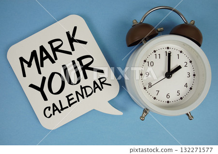 Mark Your Calendar text with alarm clock on blue background 132271577