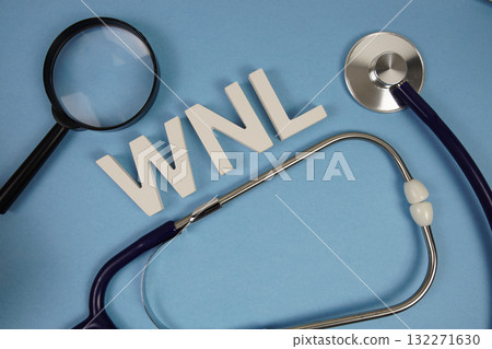 WNL abbreviation of Within Normal Limits alphabet letters with magnifying glass and stethoscope on blue background 132271630